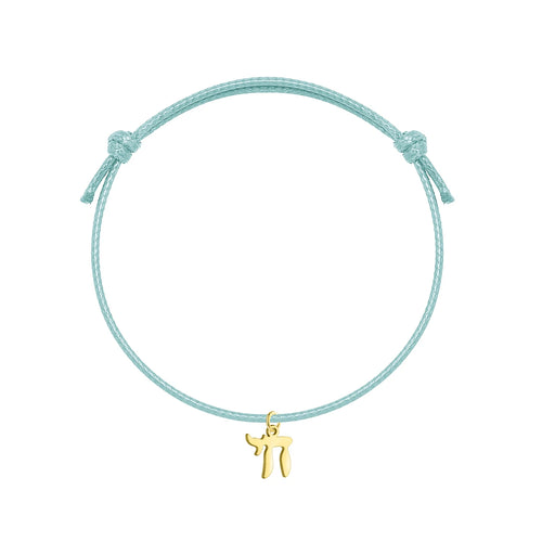Bracelet orné du symbole Haï en acier inoxydable, monté sur bracelet artisanal ajustable. Un accsesoir qui parle, simple et unique.