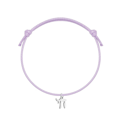 Bracelet orné du symbole Haï en acier inoxydable, monté sur bracelet artisanal ajustable. Un accsesoir qui parle, simple et unique.